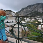 A child looking over a railing